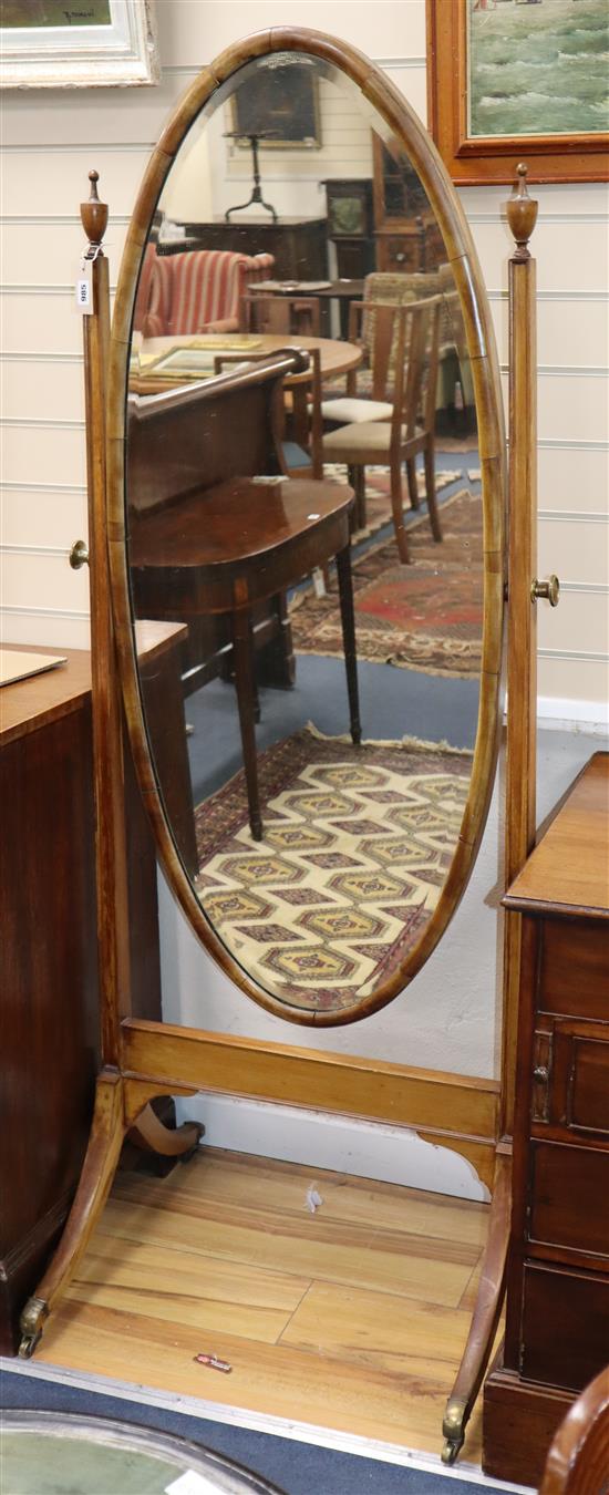 An Edwardian mahogany cheval mirror having oval plate H.176cm